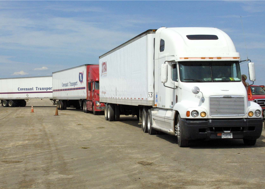 Semi trucks parked on a staging lot in Seguin, Texas, on the I-35 corridor